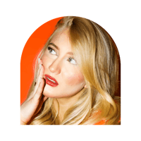 a blond woman posing with her hand on her face